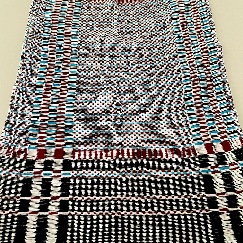 NWT  Tory Burch skirt.   fabrication in turquoise, rust , black and cream .